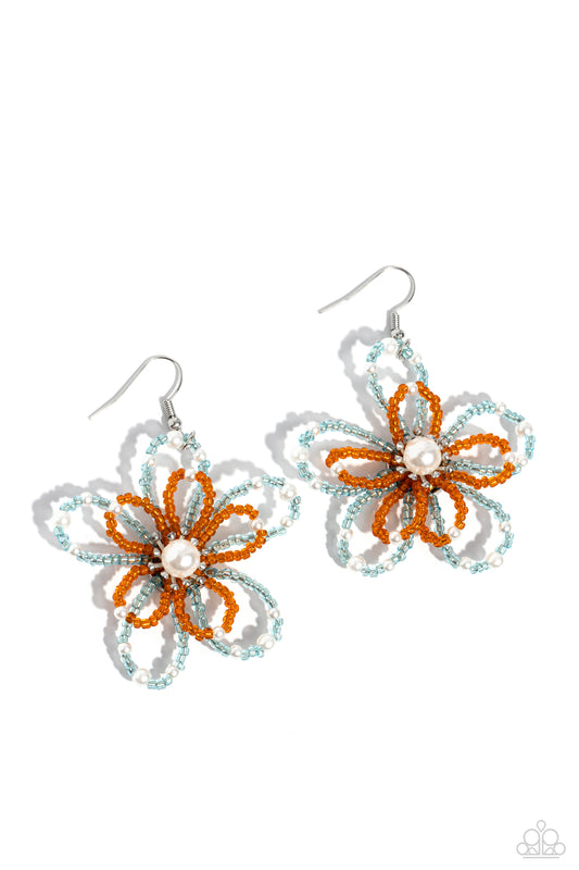 A glossy white pearl blooms from the center of a layered Burnt Orange and tiffany glassy bead flower, infused with additional dainty white pearls, creating a colorful floral frame. Earring attaches to a standard fishhook fitting.