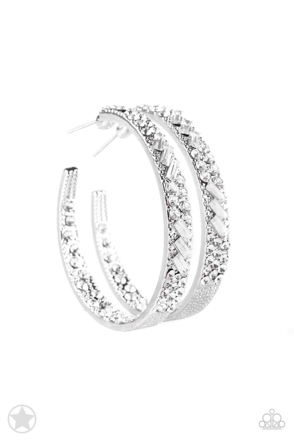 The front facing surface of a chunky silver hoop is dipped in brilliantly sparkling rhinestones while light-catching texture wraps around the back. The interior of the hoop features the opposite pattern, creating the illusion of a full hoop of blinding rhinestones. Earring attaches to a standard post fitting. Hoop measures 1 3/4" in diameter.