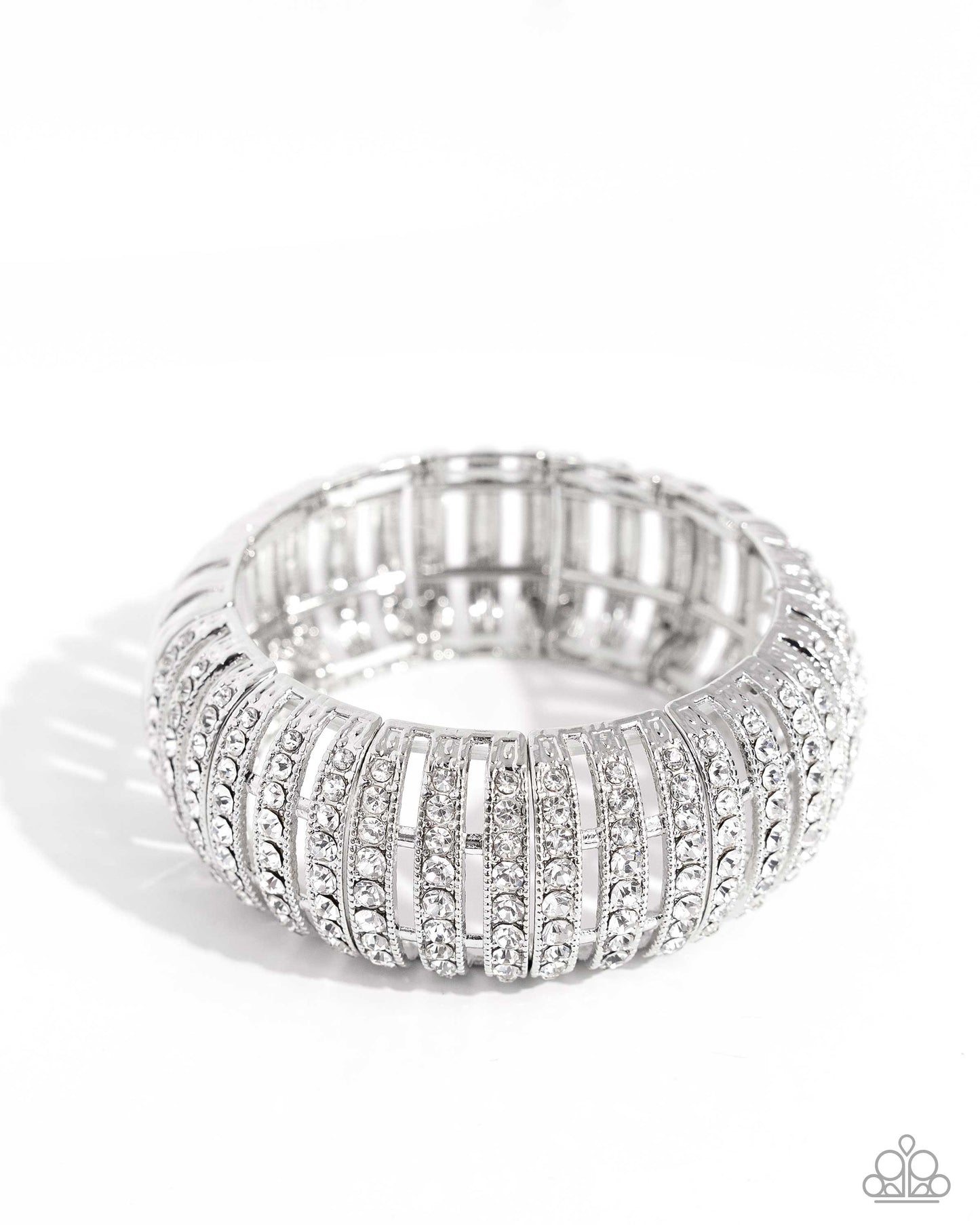 Featuring glistening white gems, trios of curved silver bars join high-sheen curved silver bars for a radiant, light-catching display around the wrist on elastic stretchy bands