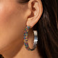 Set in silver square fittings, row after row of multicolored rhinestones are embellished around a silver hoop for a dazzling design. Earring attaches to a standard post fitting. Hoop measures approximately 2" in diameter.
