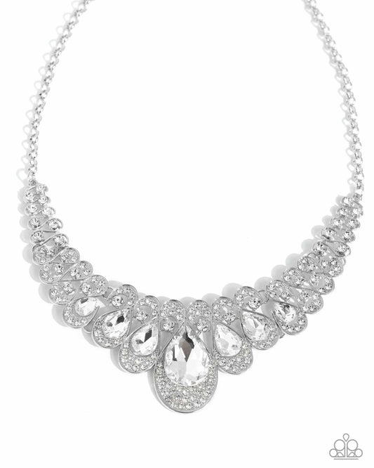 Pressed in thin, curly silver infinity-like frames, solitaire white rhinestones gradually elongate into faceted shimmery teardrop gems. A collection of dainty, airy white rhinestones dusts the caps of each teardrop frame for additional glitz and glamor. Features an adjustable clasp closure.